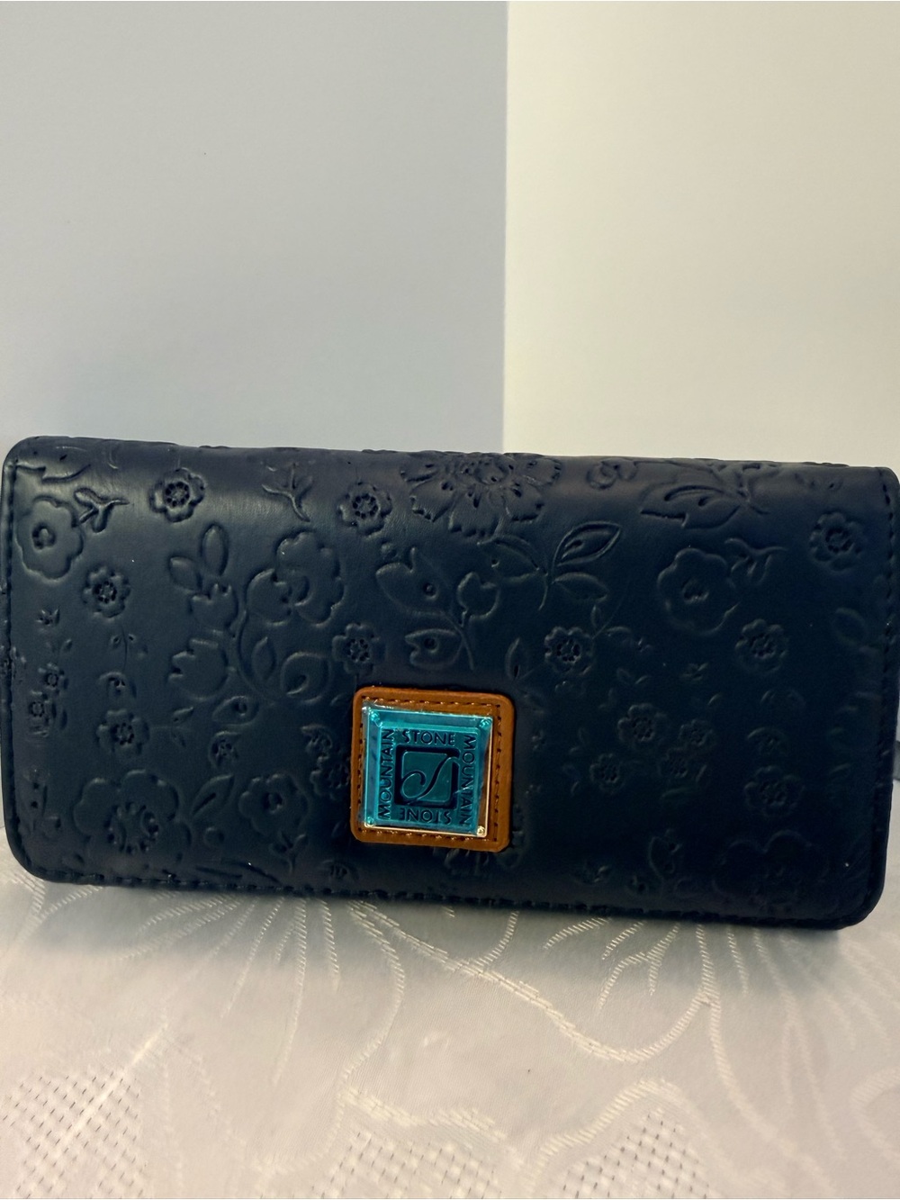Stone Mountain Accessories Navy Floral Embossed Leather Wallet
